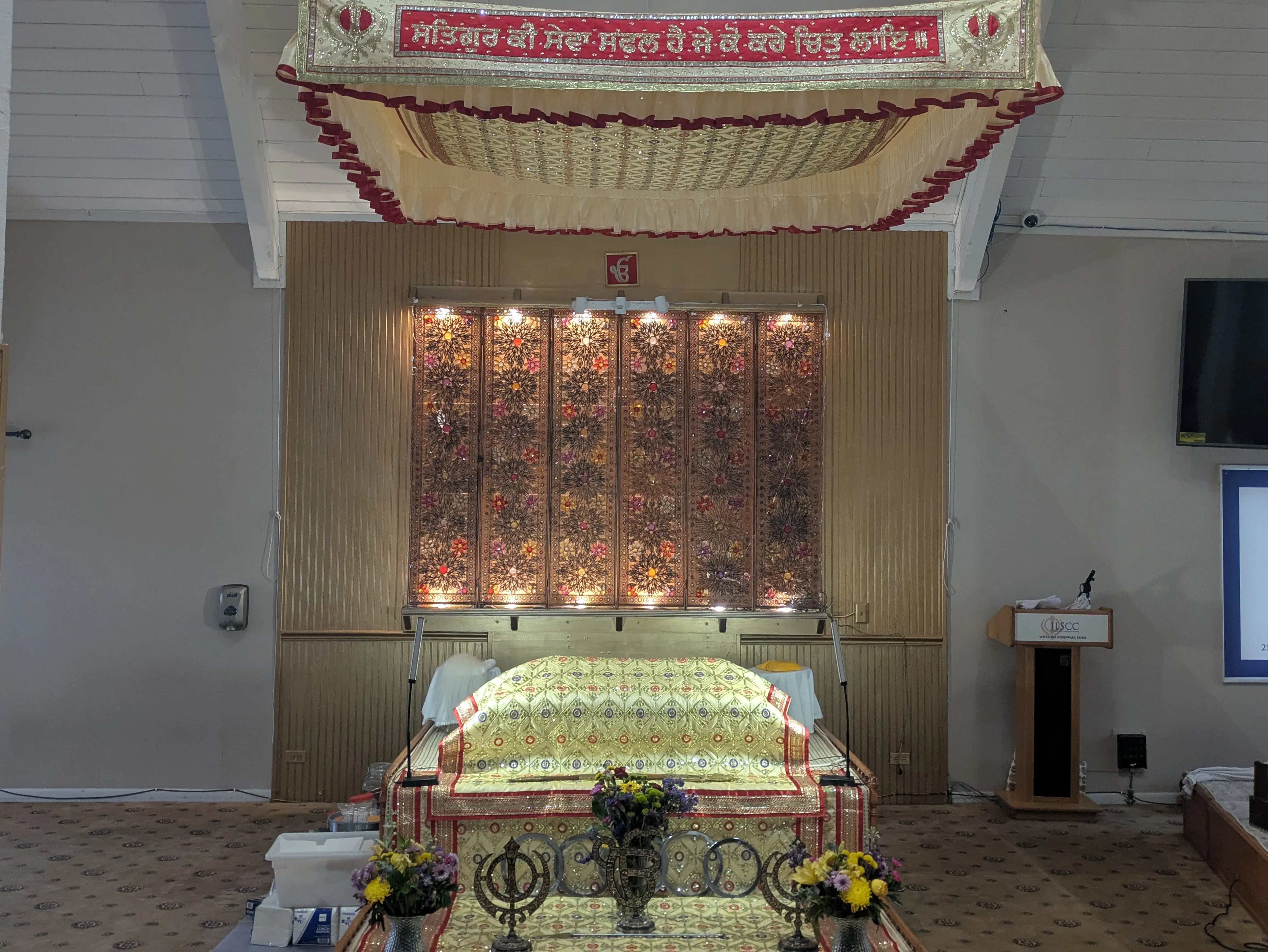 Sri Guru Granth Sahib Ji on the Palki Sahib in the Darbar hall