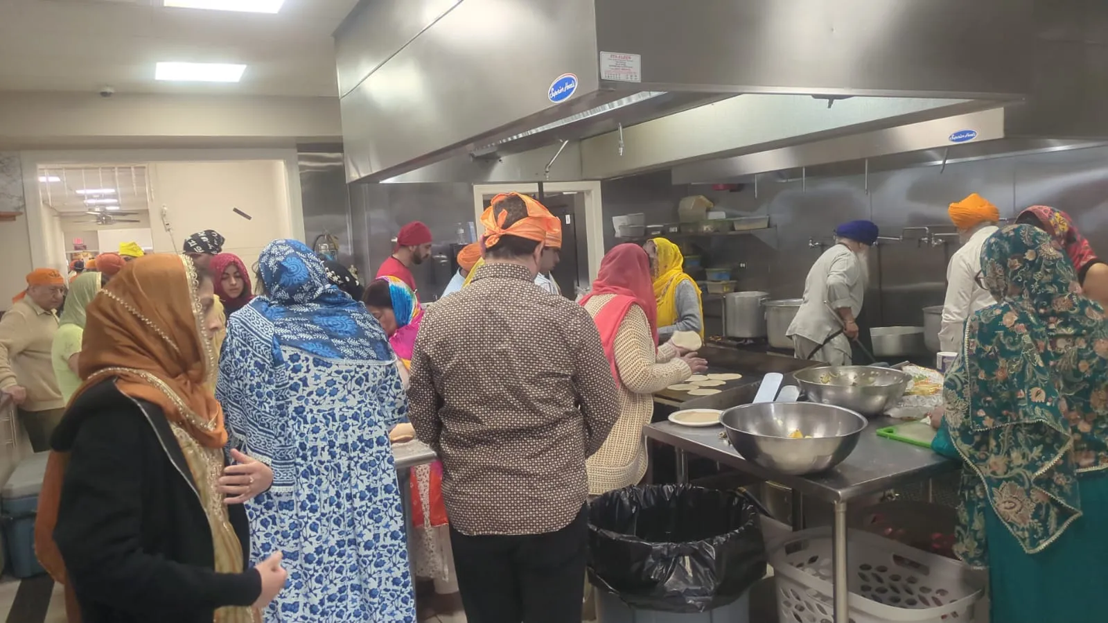 Sevadars cooking together for the sangat